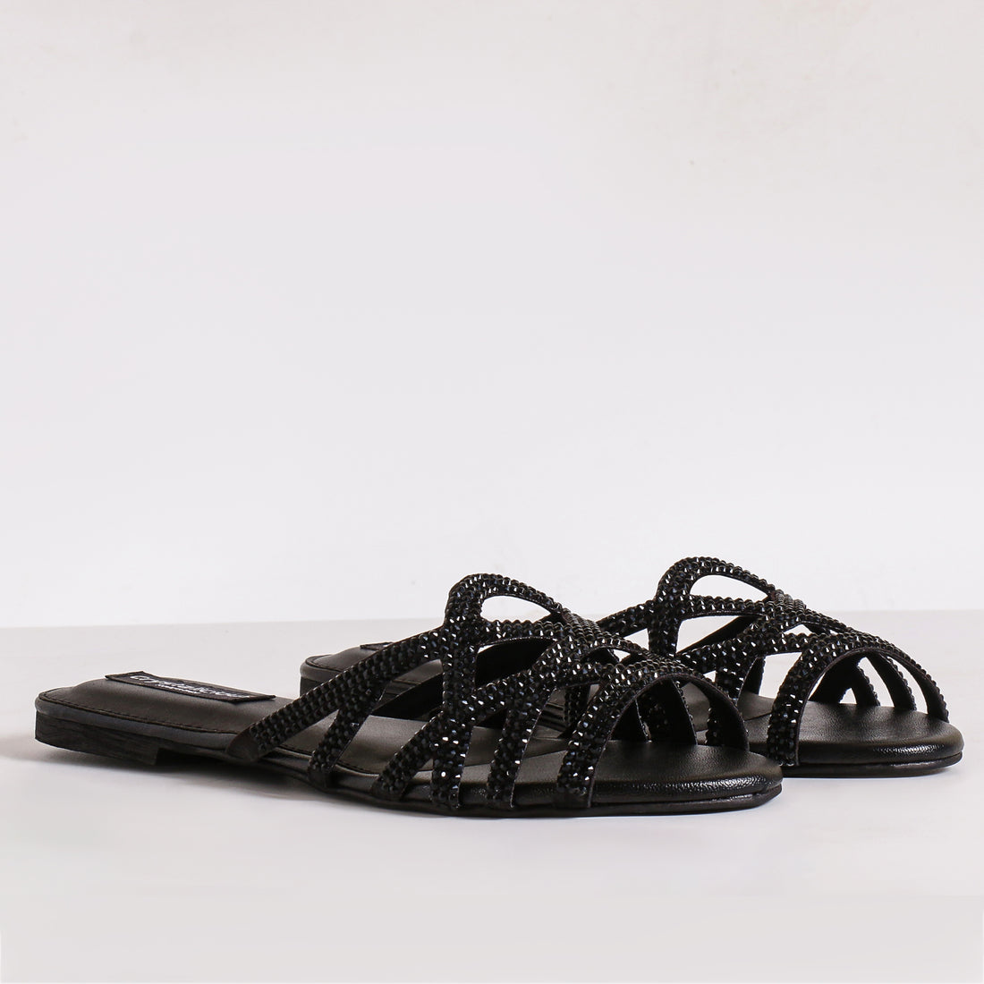 Crystalicious black embellished strappy sandals for women – handcrafted luxury footwear with intricate beadwork and elegant open-toe design. Perfect for evening wear and special occasions.